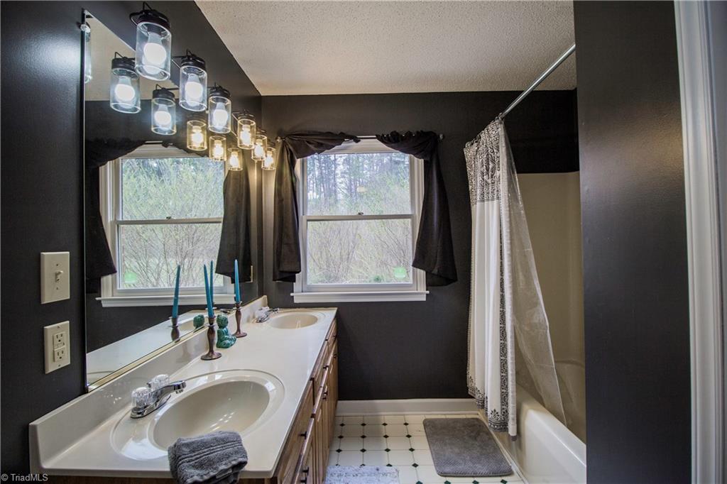 1435 Stewart Road Walnut Cove, NC 27052 - Photo 26 of 30 Master Bathroom with separate tub and shower.