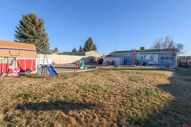 a view of a houses with a yard