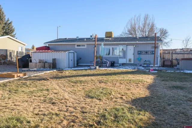a swimming pool view with a seating space