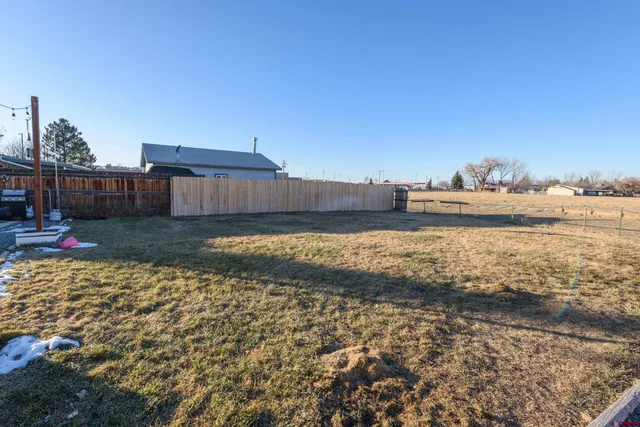 a kitchen with stainless steel appliances sink refrigerator stove and wooden floor