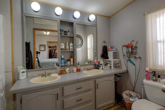 a bathroom with a sink vanity and a mirror
