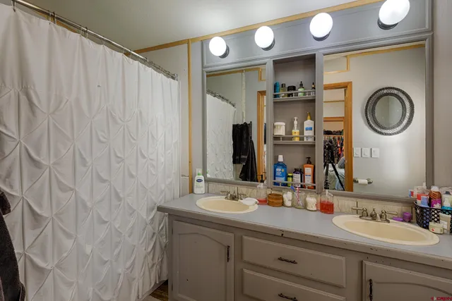 a bedroom with a bed and a television