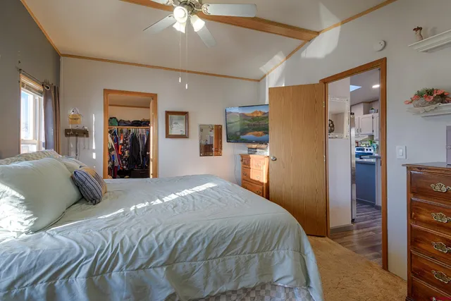 a view of walk in closet with clothes