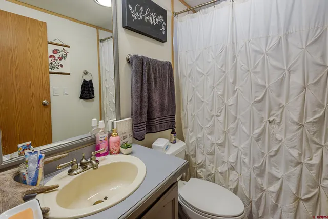 a front view of a house with trees