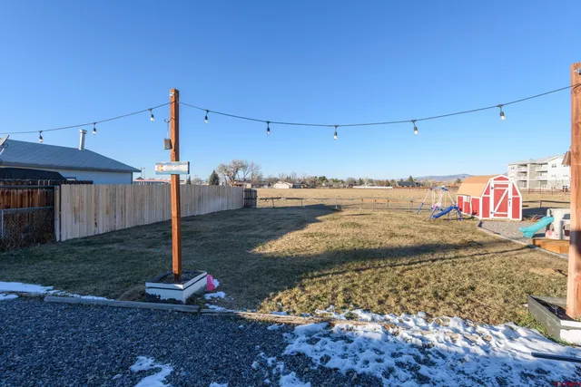 a view of a backyard of the house