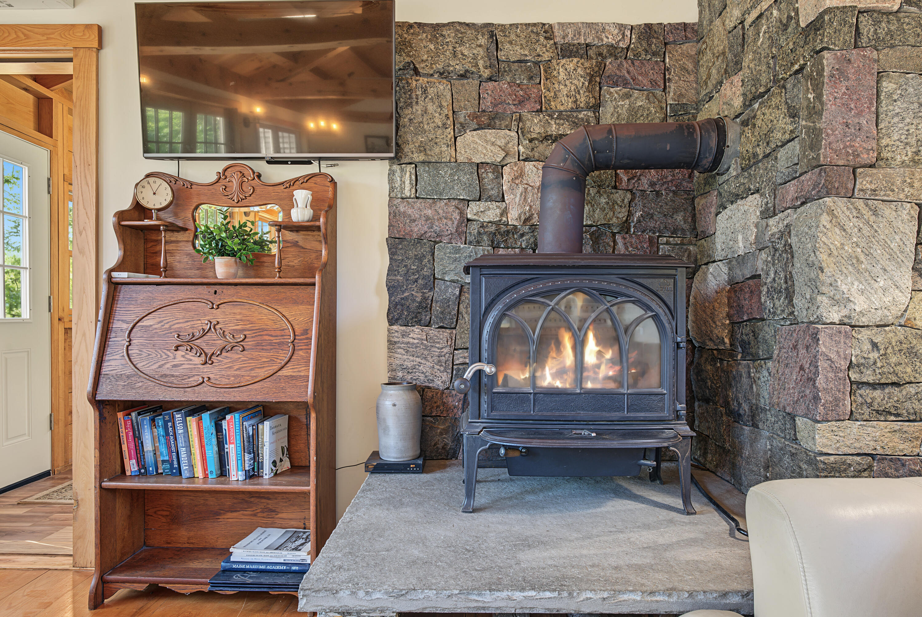 1581 Main Road Westport Island, ME 04578 - Photo 13 of 86 Living room with cozy wood stove