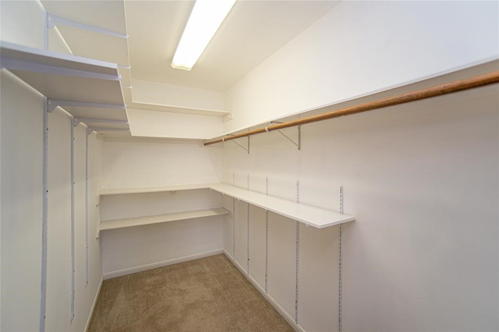 28816 South Diamondhead Conroe, TX 77356 - Photo 19 of 23 a storage room with empty racks