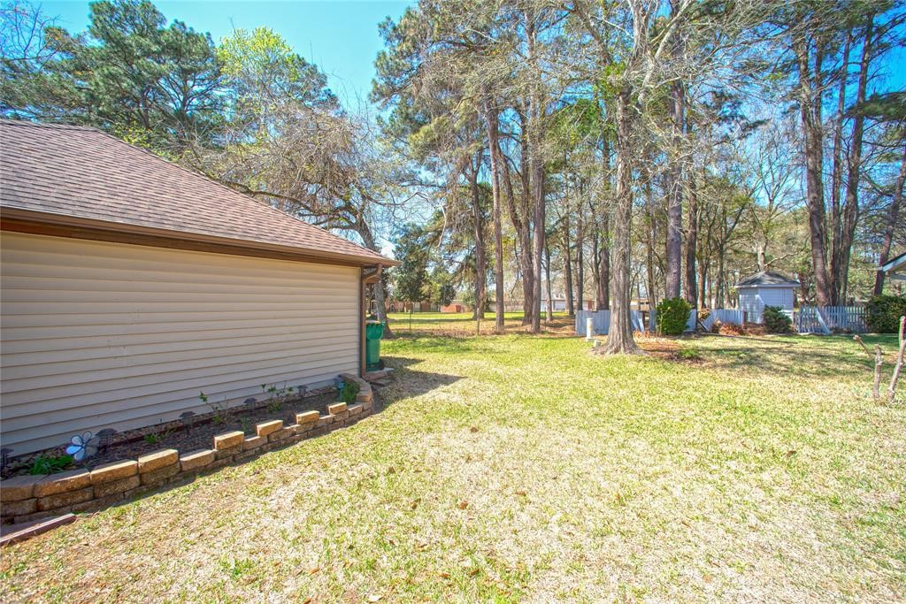 28816 South Diamondhead Conroe, TX 77356 - Photo 23 of 23 a view of yard with swimming pool and tree