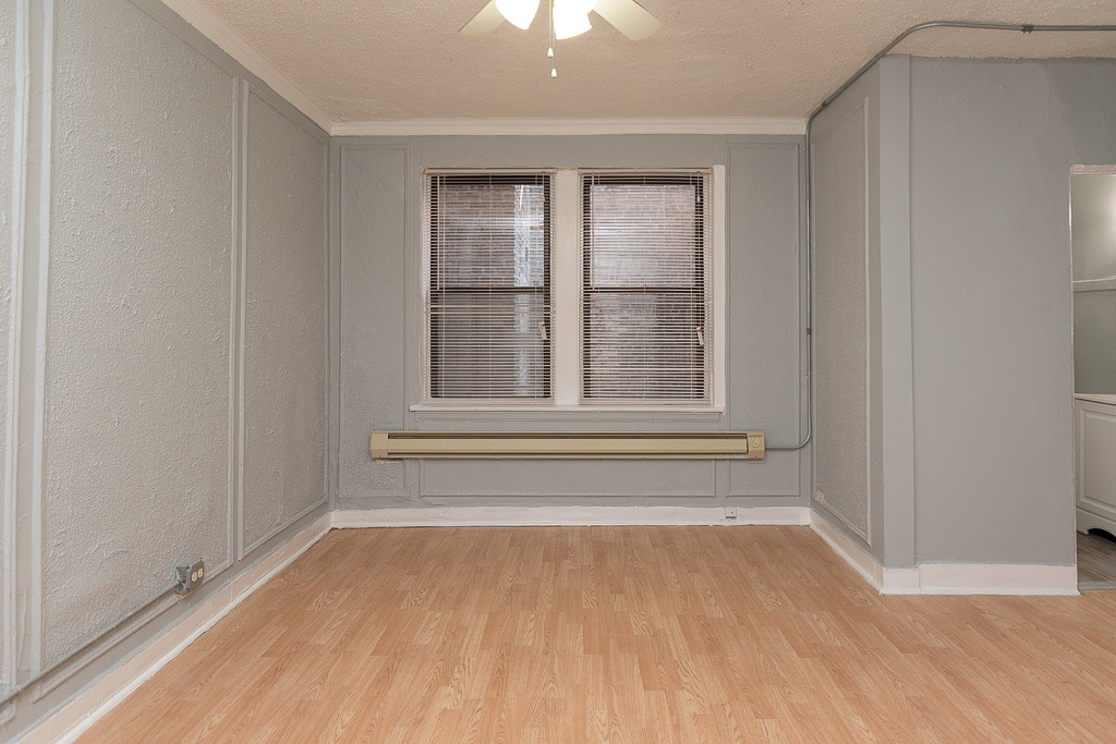 4735 North Beacon Street, Unit 314 Chicago, IL 60640 - Photo 5 of 15 a view of an empty room with a window