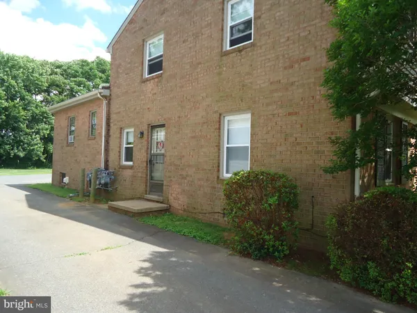 a brick building with a yard