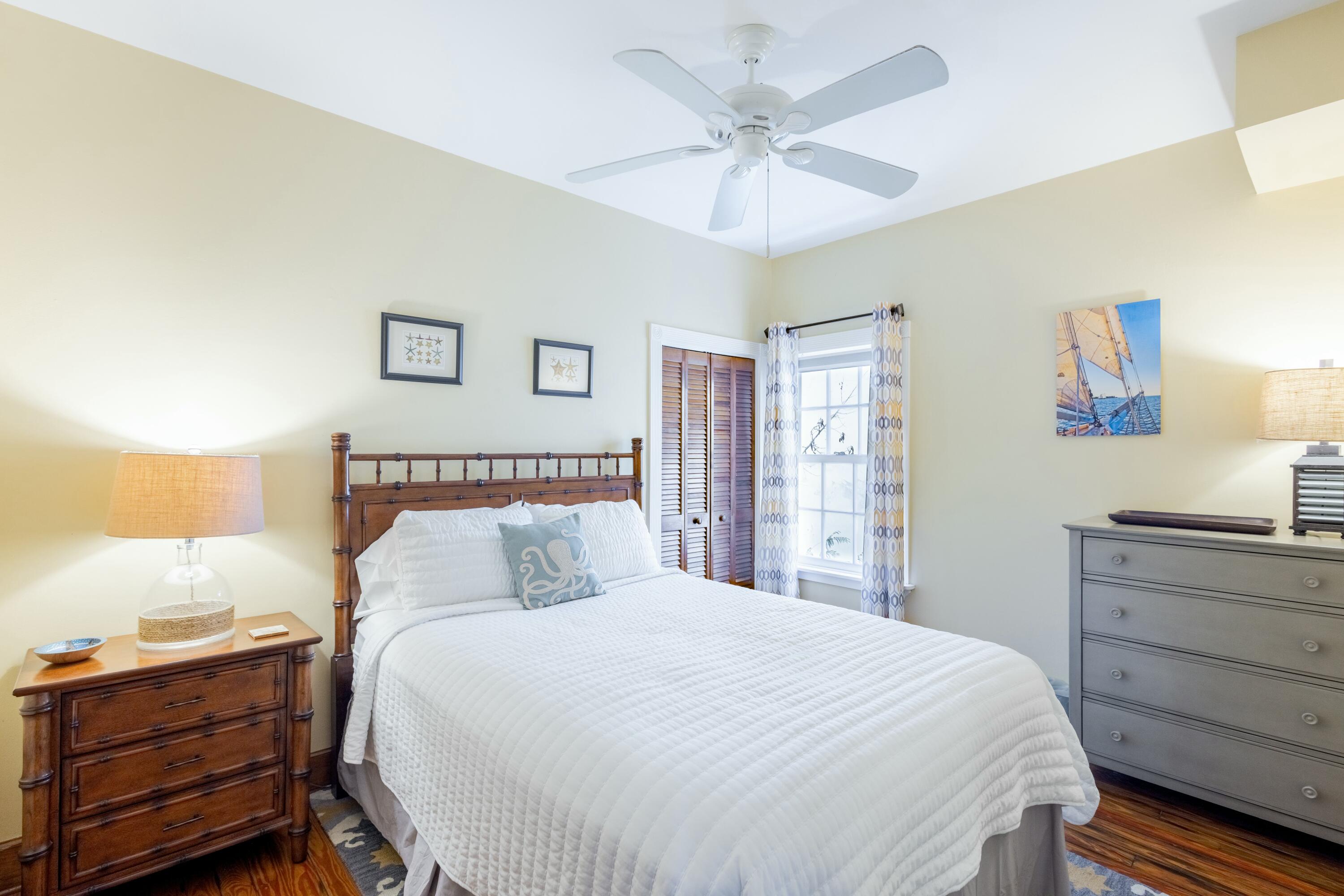 1033 Catherine Street Key West, FL 33040 - Photo 15 of 39 a bedroom with a bed and a dresser