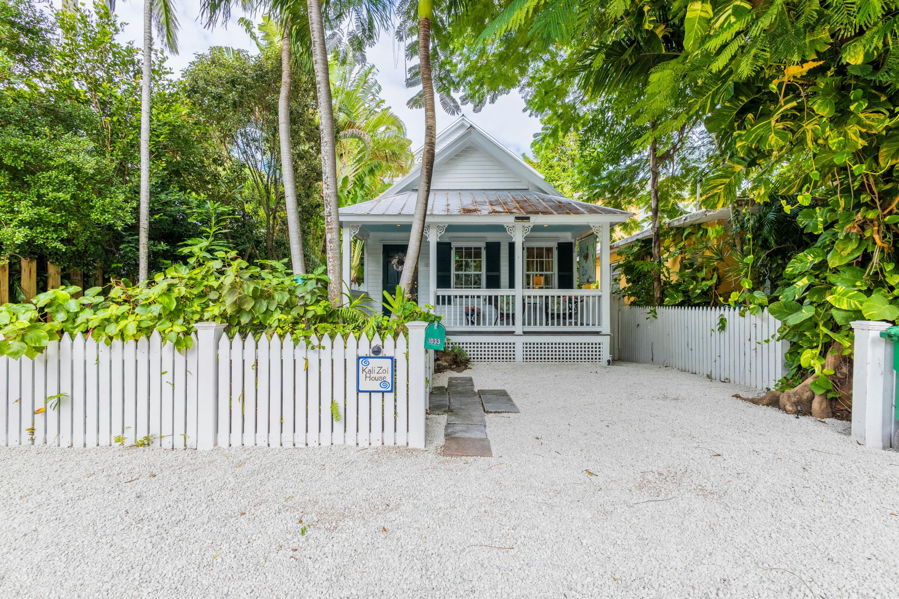 1033 Catherine Street Key West, FL 33040 - Photo 2 of 39 a front view of a house with a garden