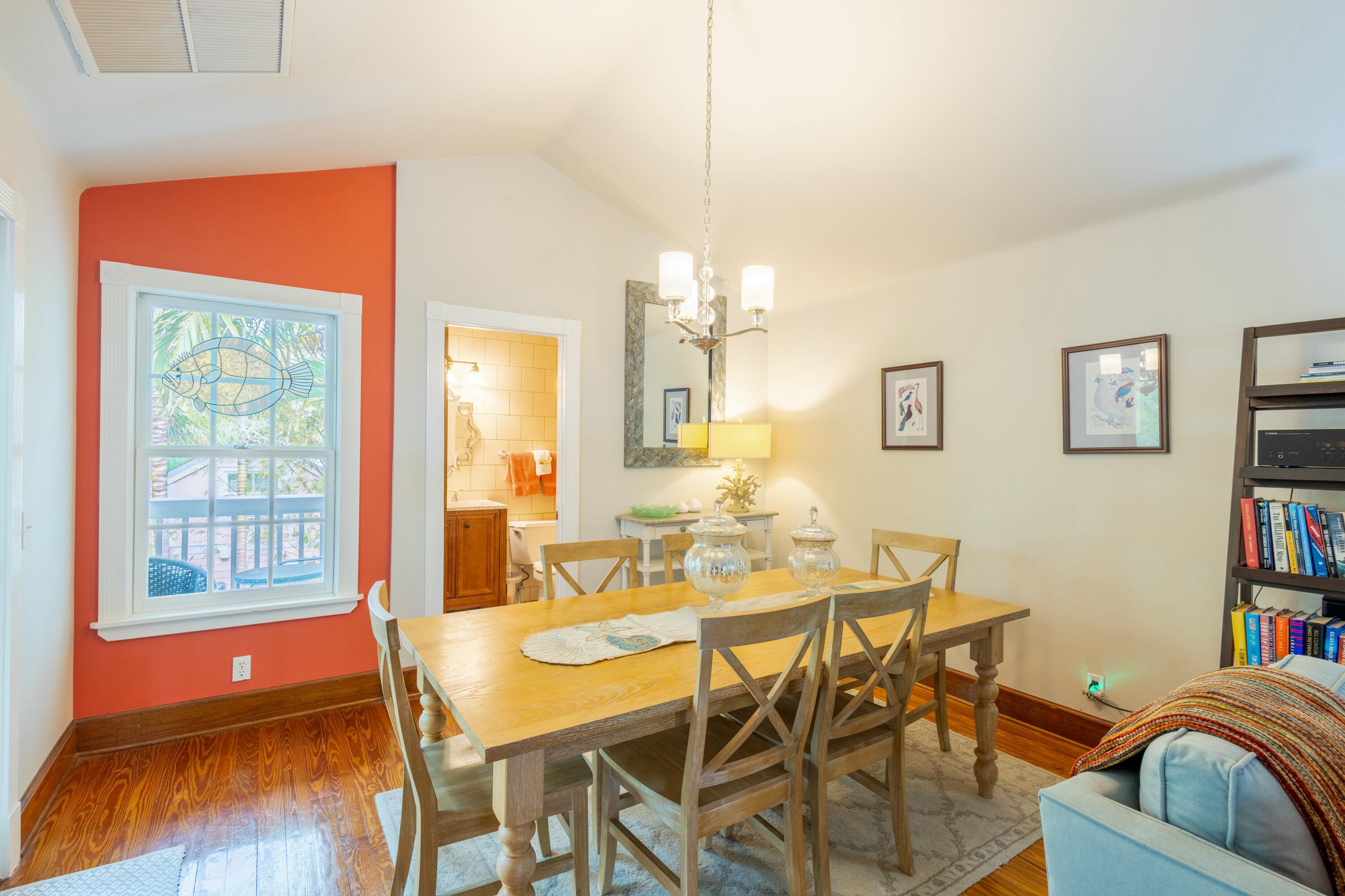 1033 Catherine Street Key West, FL 33040 - Photo 22 of 39 a dining room with furniture and a window
