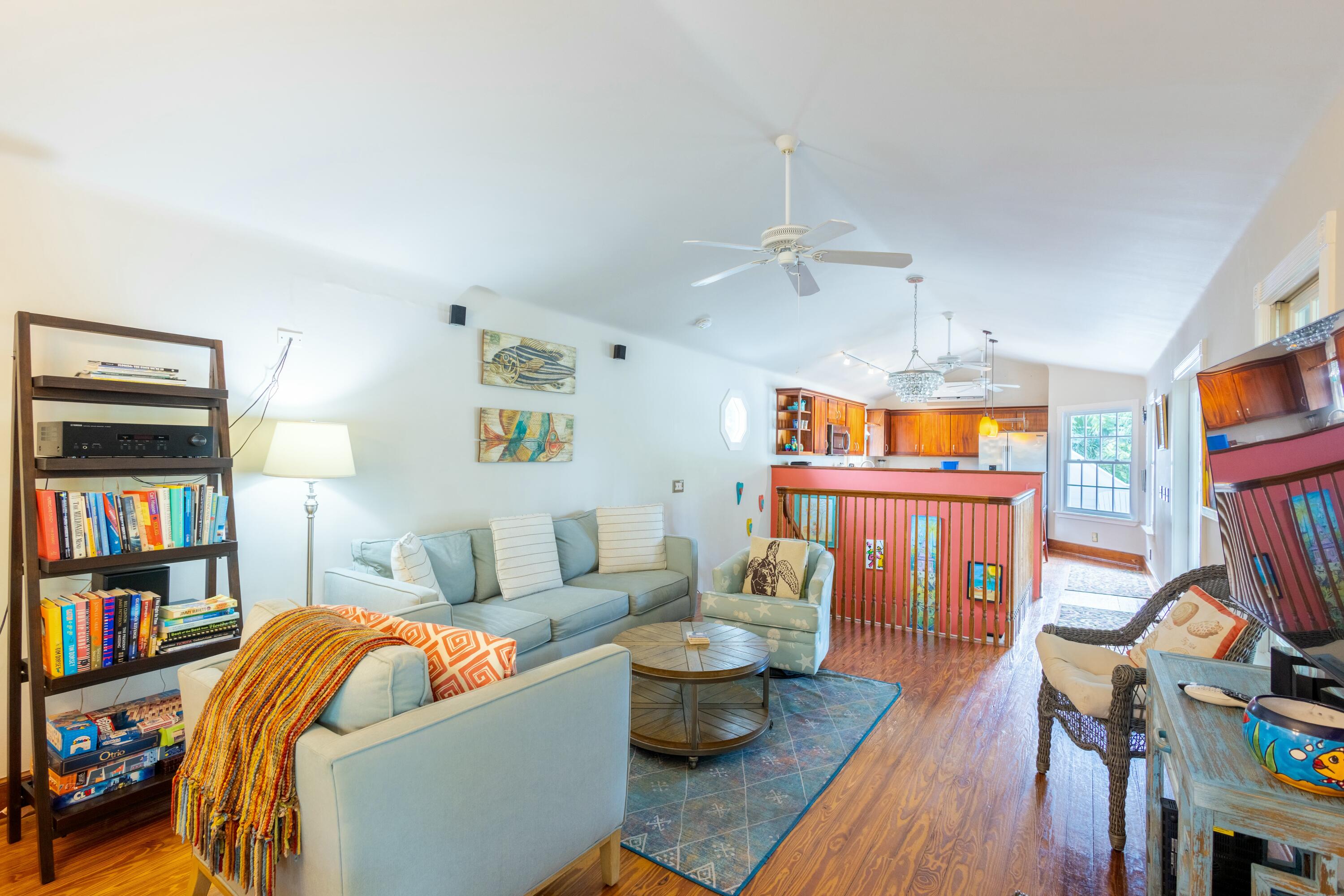 1033 Catherine Street Key West, FL 33040 - Photo 24 of 39 a living room with furniture and a book shelf