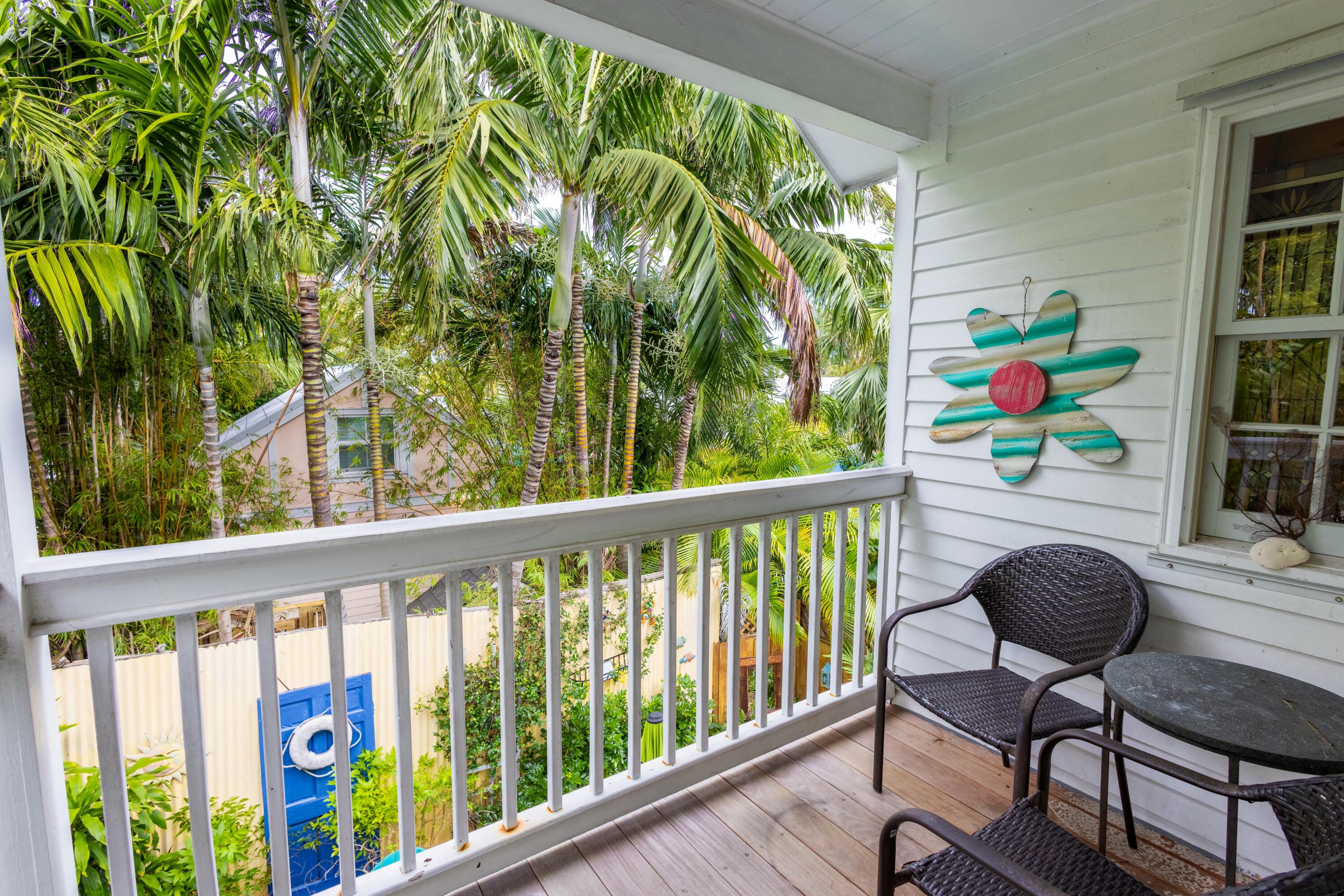 1033 Catherine Street Key West, FL 33040 - Photo 29 of 39 a view of a chairs and table in a balcony