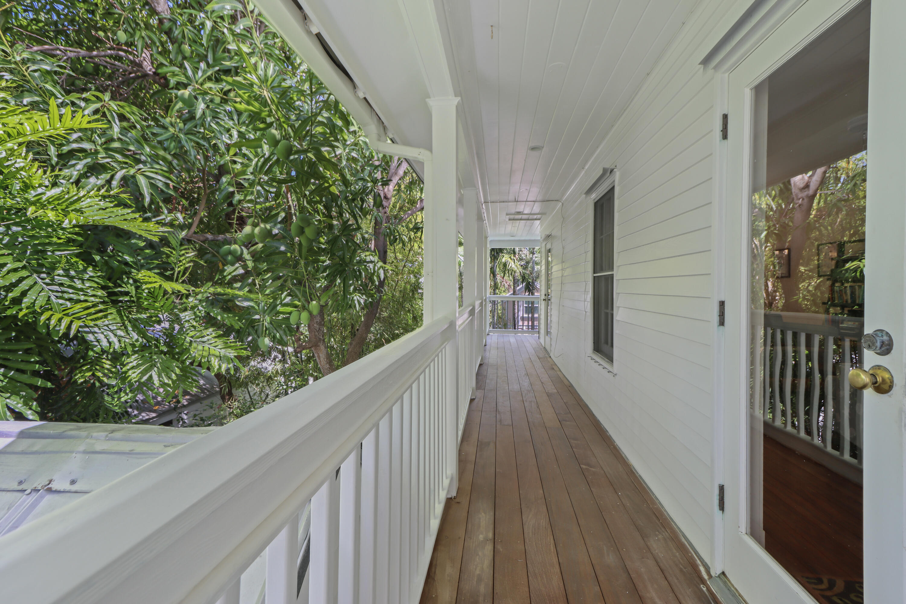 1033 Catherine Street Key West, FL 33040 - Photo 31 of 39 a view of a balcony with wooden floor