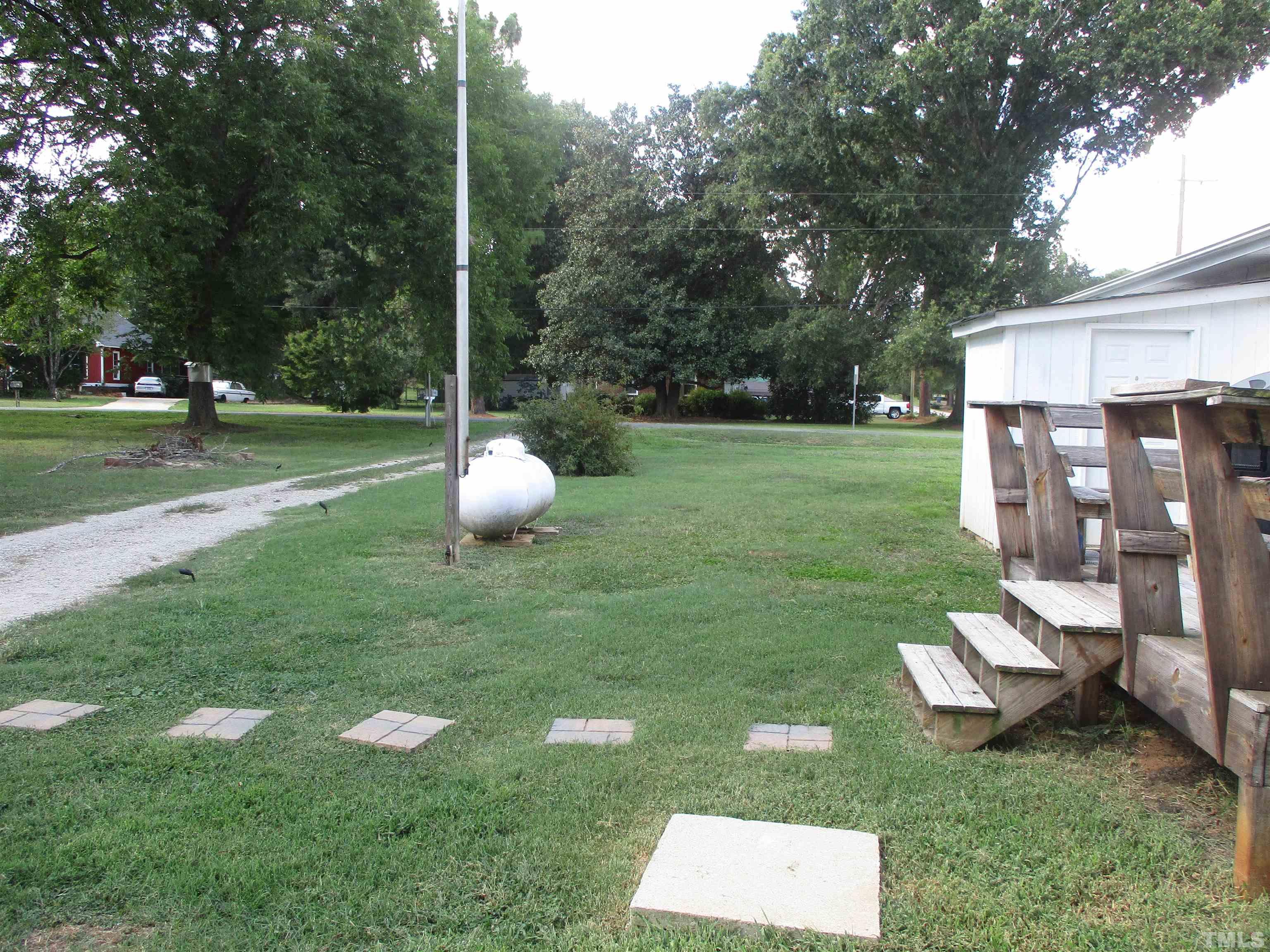 9900 Fanny Brown Road Raleigh, NC 27603 - Photo 3 of 9 a view of a garden with a slide