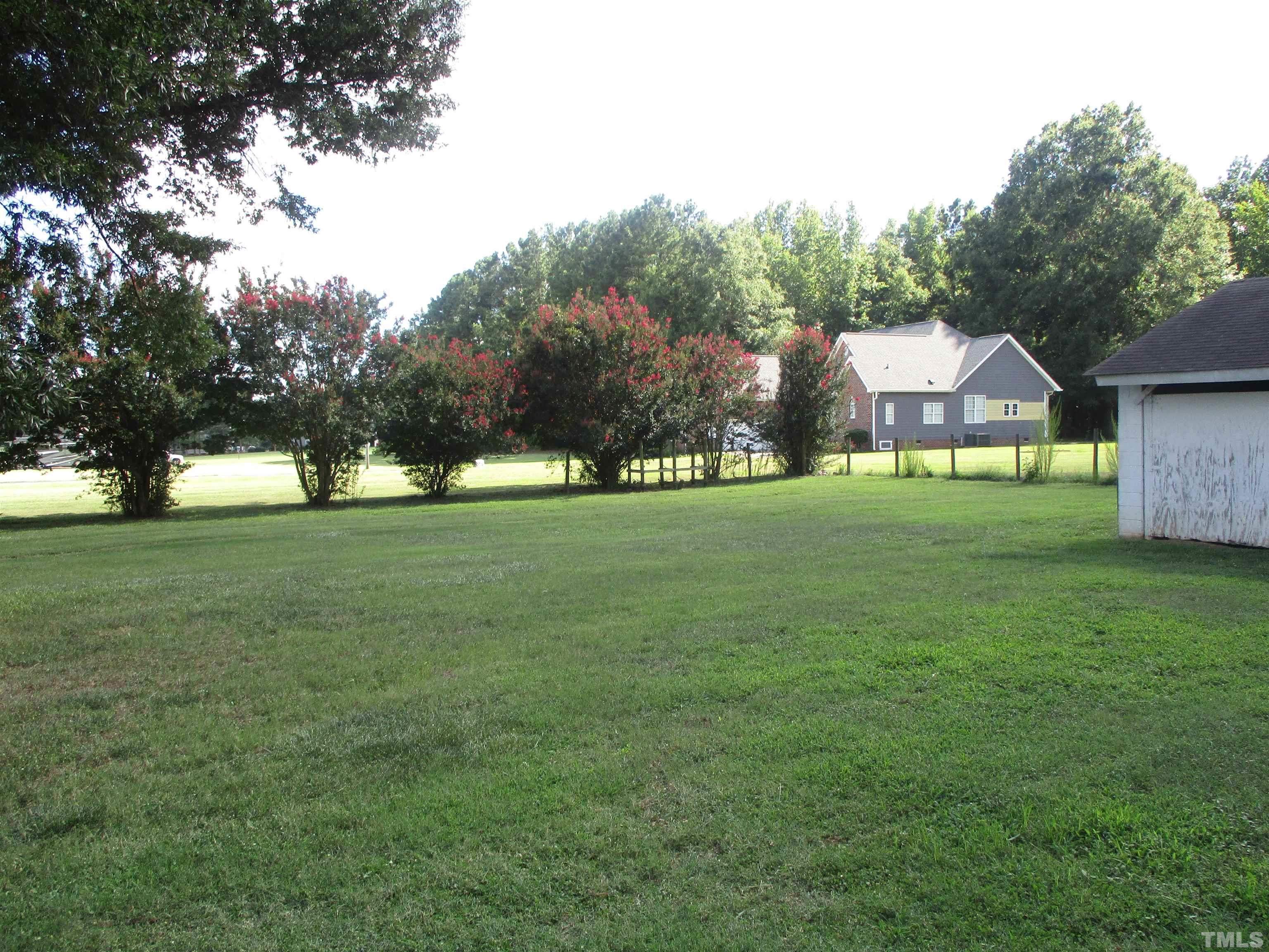9900 Fanny Brown Road Raleigh, NC 27603 - Photo 4 of 9 a view of a green field