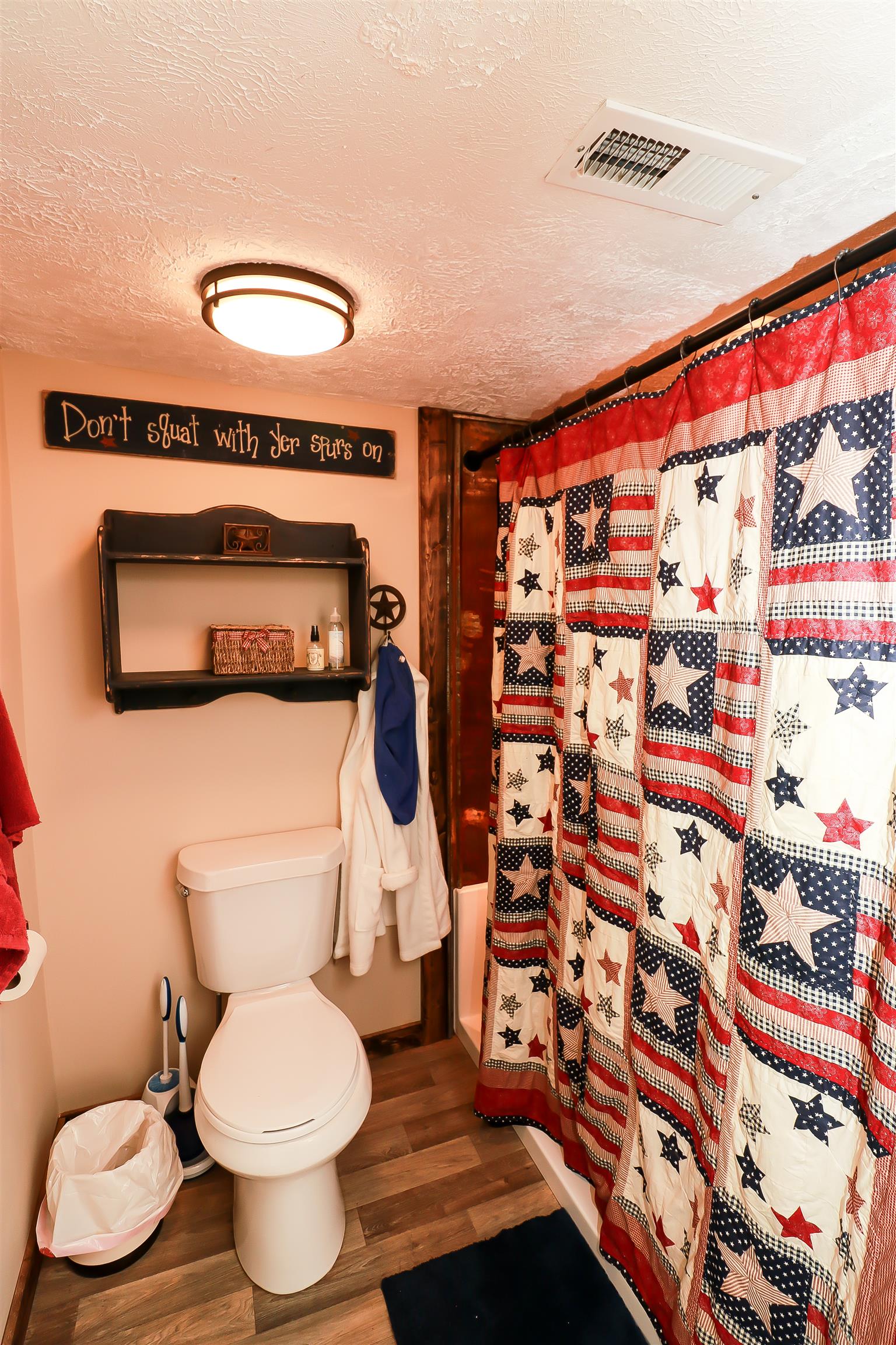 4639 Cathey Ridge Road Manchester, TN 37355 - Photo 12 of 30 a bathroom with a toilet and a shower curtain