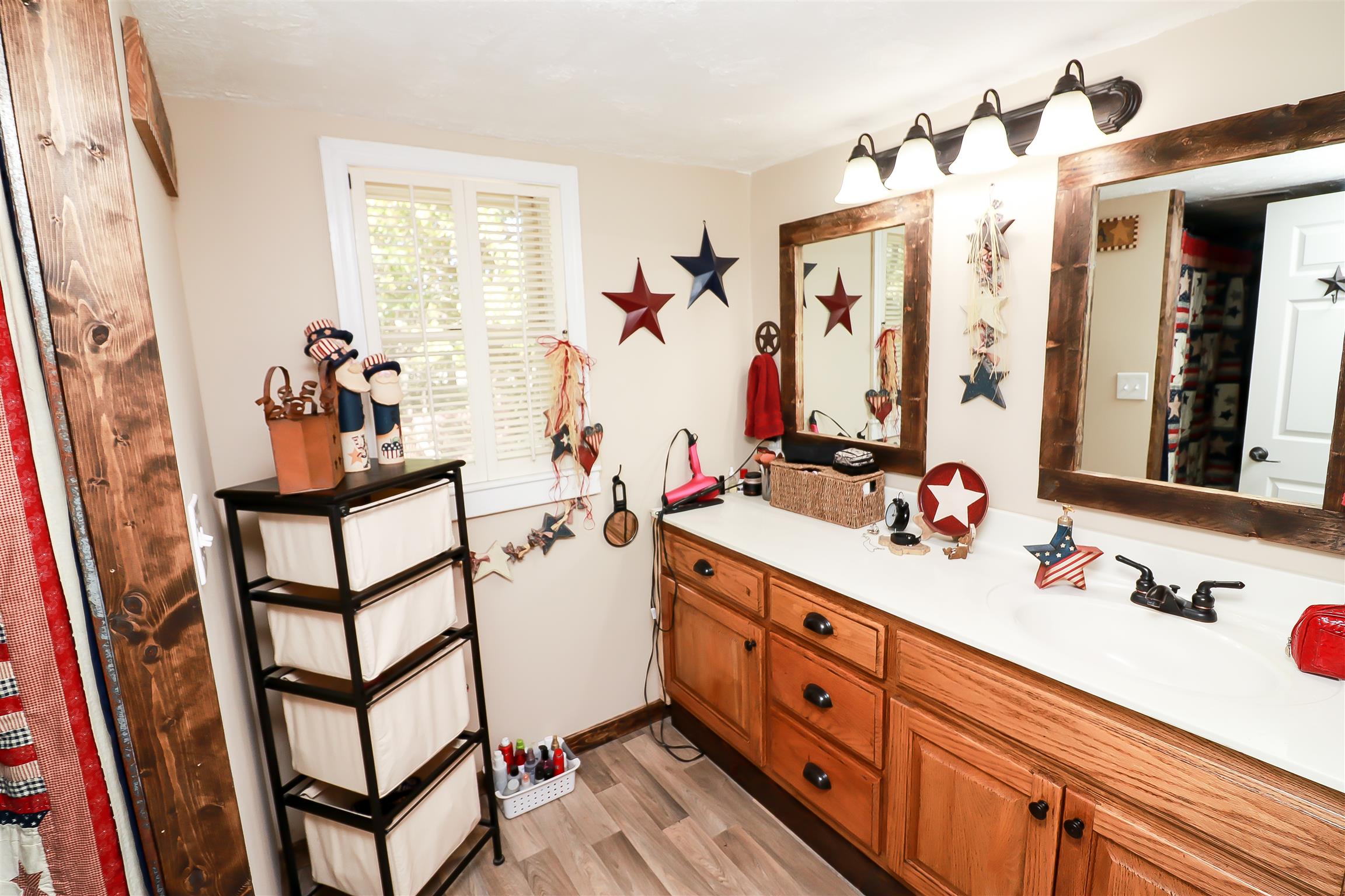 4639 Cathey Ridge Road Manchester, TN 37355 - Photo 13 of 30 a bathroom with a double vanity sink mirror and shower