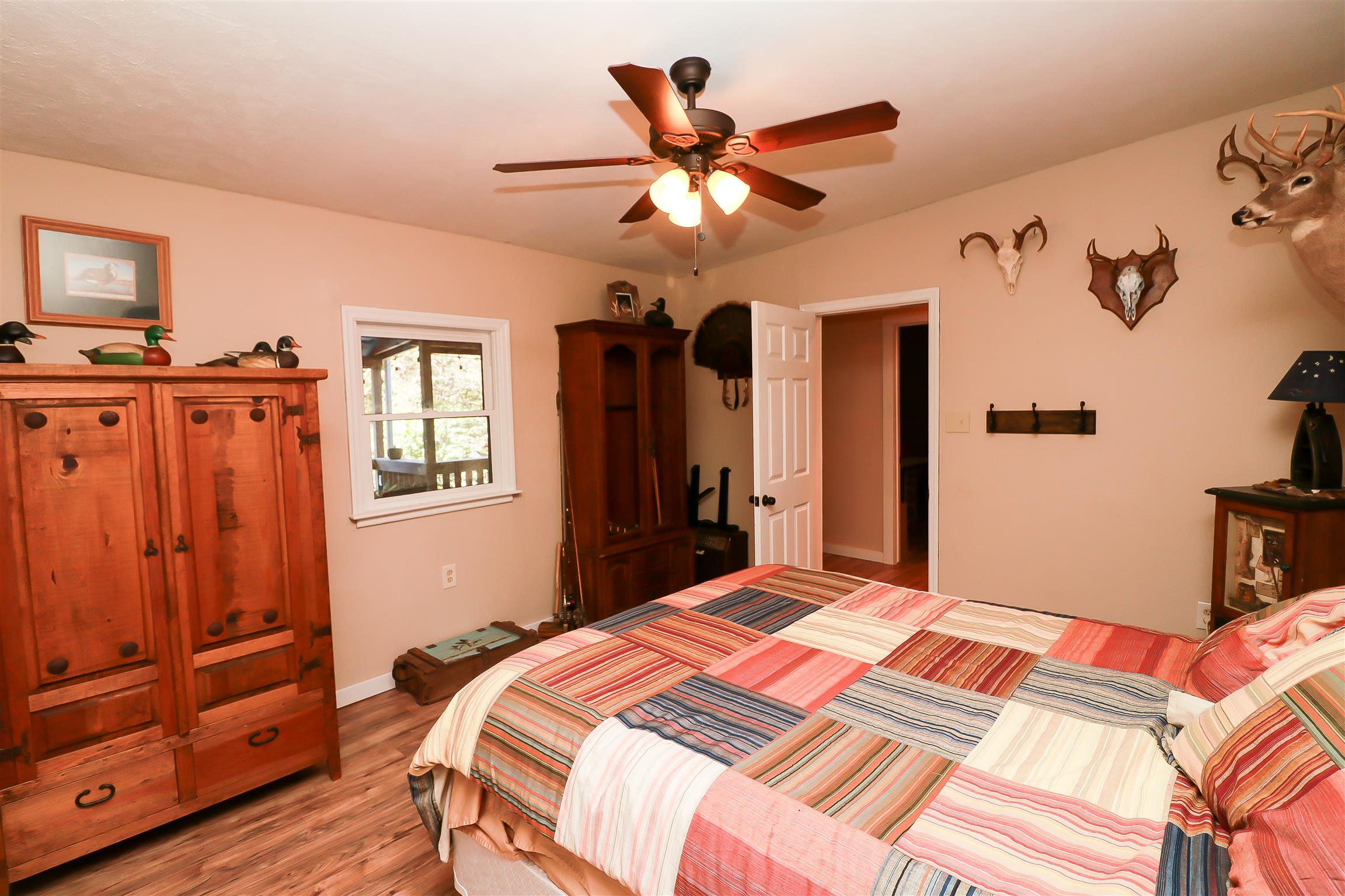 4639 Cathey Ridge Road Manchester, TN 37355 - Photo 15 of 30 a bedroom with a bed and a ceiling fan