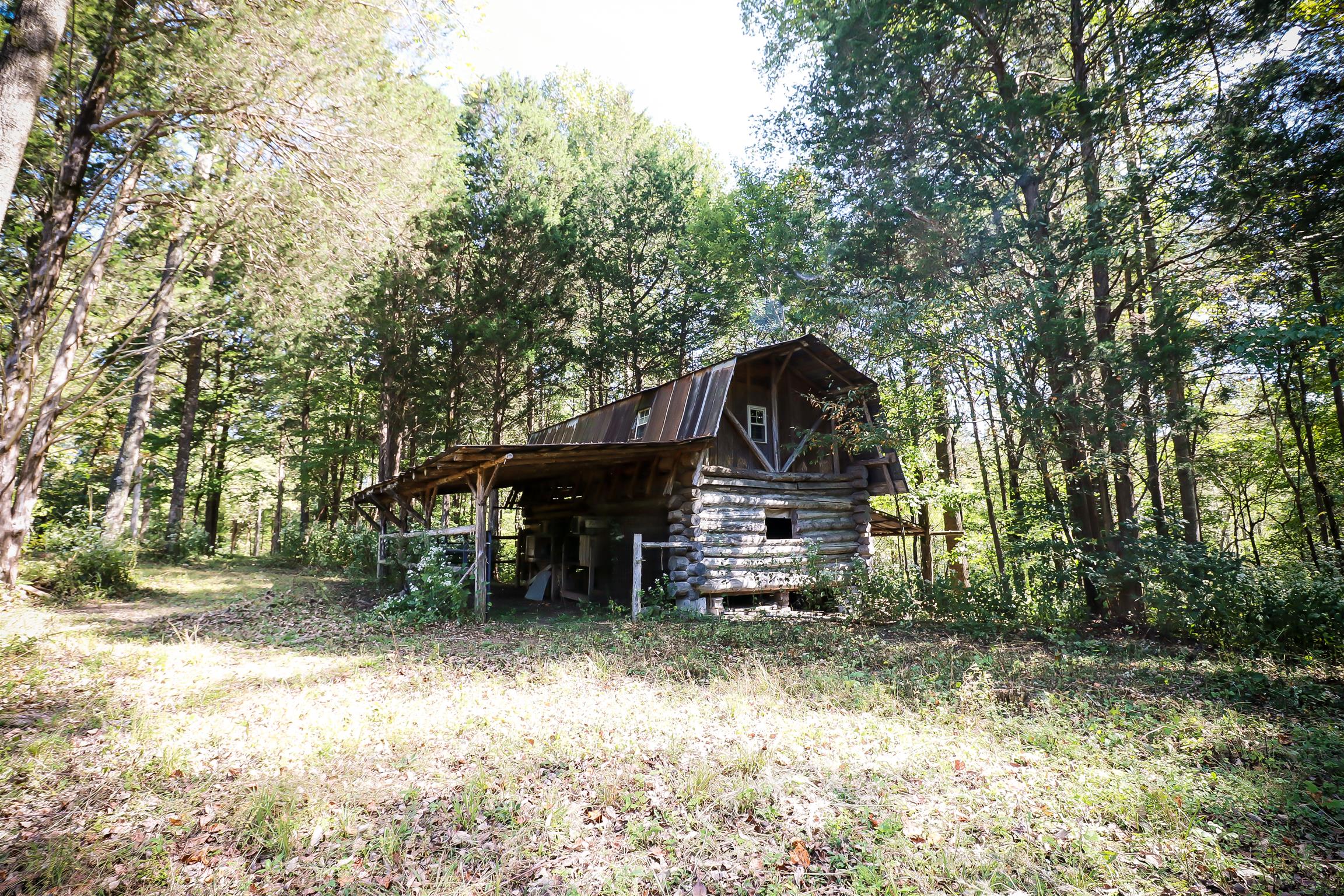 4639 Cathey Ridge Road Manchester, TN 37355 - Photo 22 of 30 a backyard of a house with table and chairs