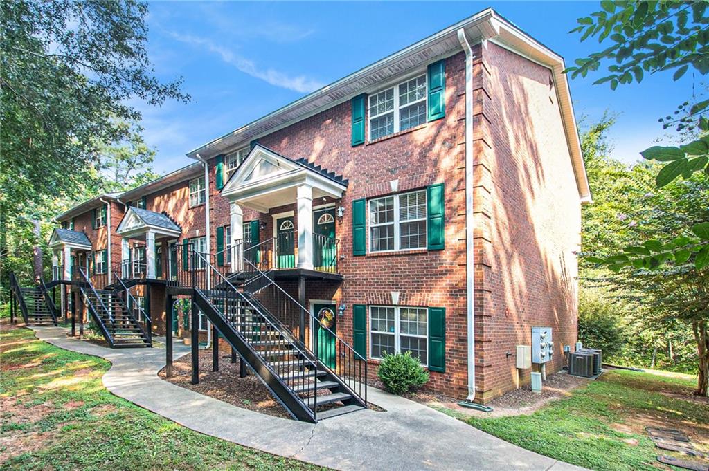 600 Mitchell Bridge Road, Unit 9 Athens, GA 30606 - Photo 1 of 1 a front view of a house with a yard