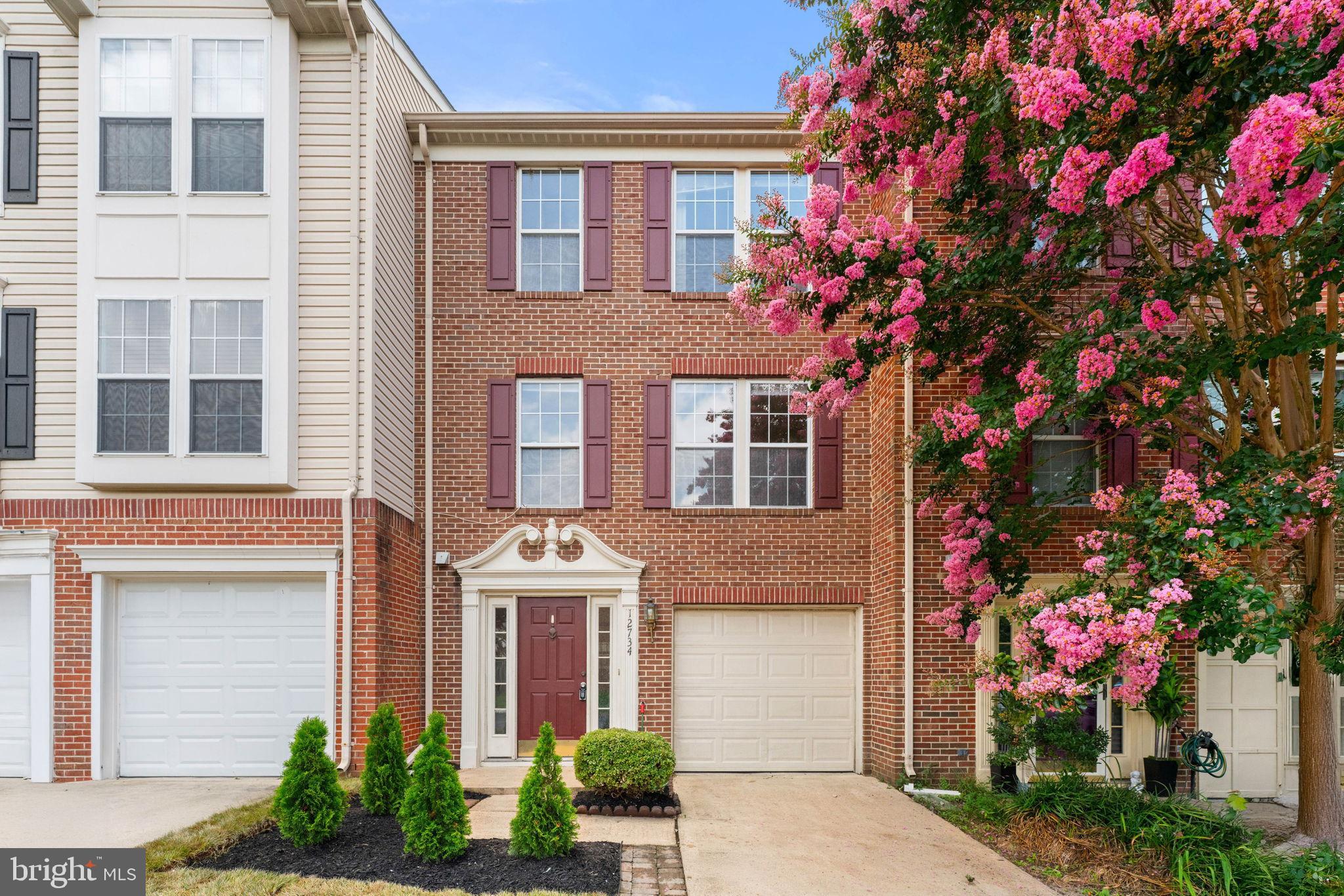 12734 Silvia Loop Woodbridge, VA 22192 - Photo 1 of 22 a front view of a house with yard