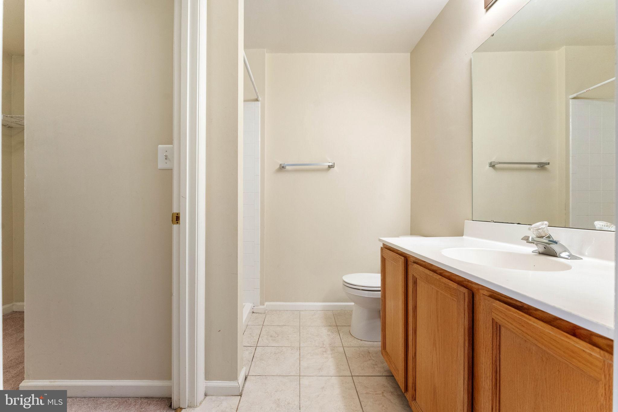 12734 Silvia Loop Woodbridge, VA 22192 - Photo 11 of 22 a bathroom with a sink a toilet and shower