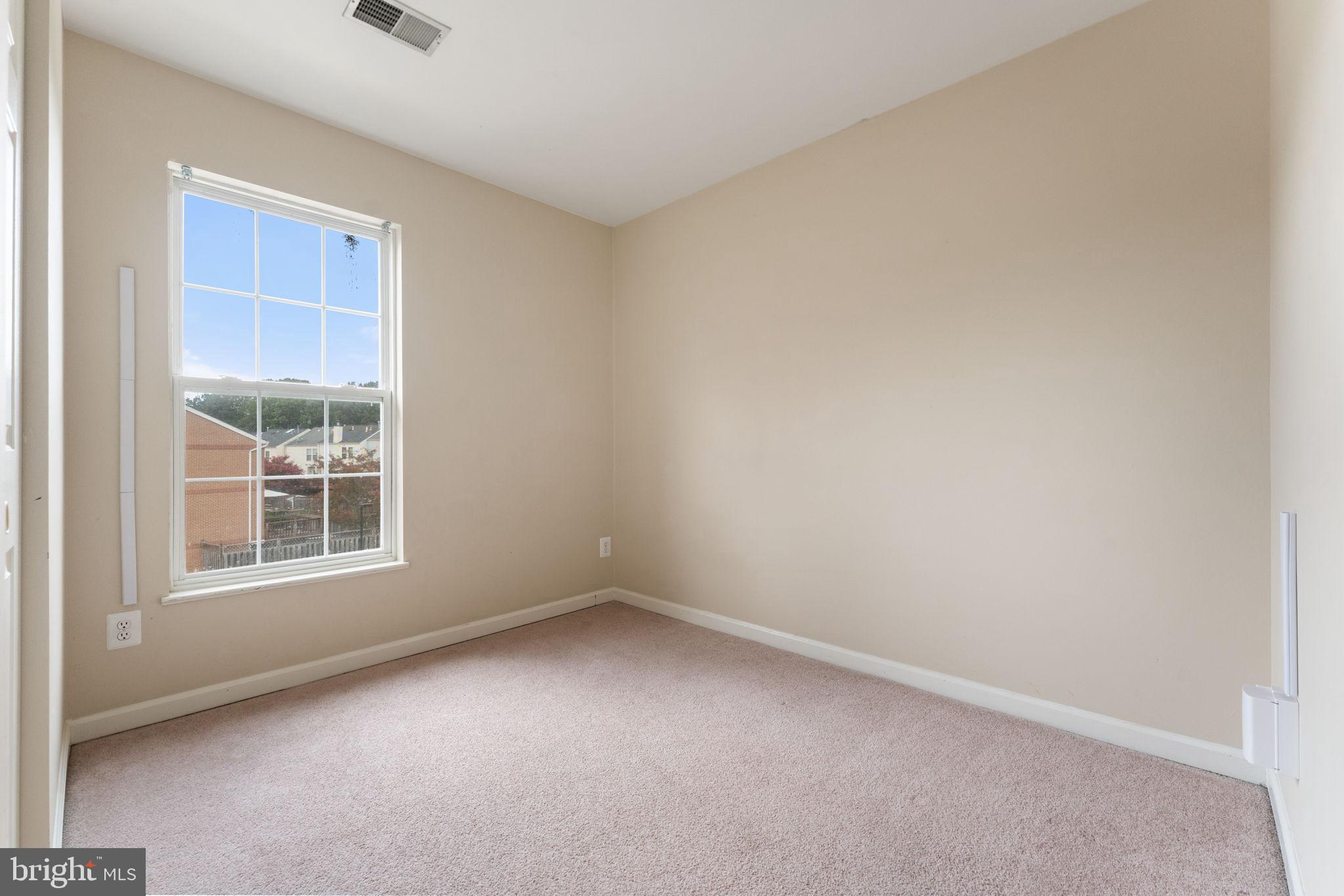 12734 Silvia Loop Woodbridge, VA 22192 - Photo 14 of 22 an empty room with a window