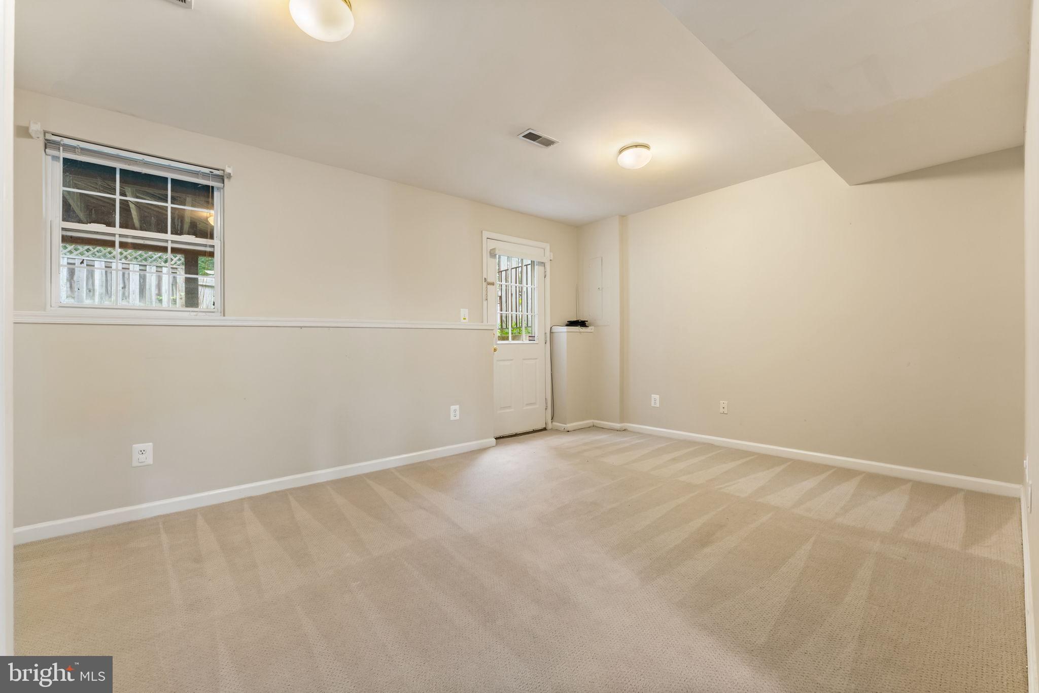12734 Silvia Loop Woodbridge, VA 22192 - Photo 15 of 22 a view of an empty room with windows