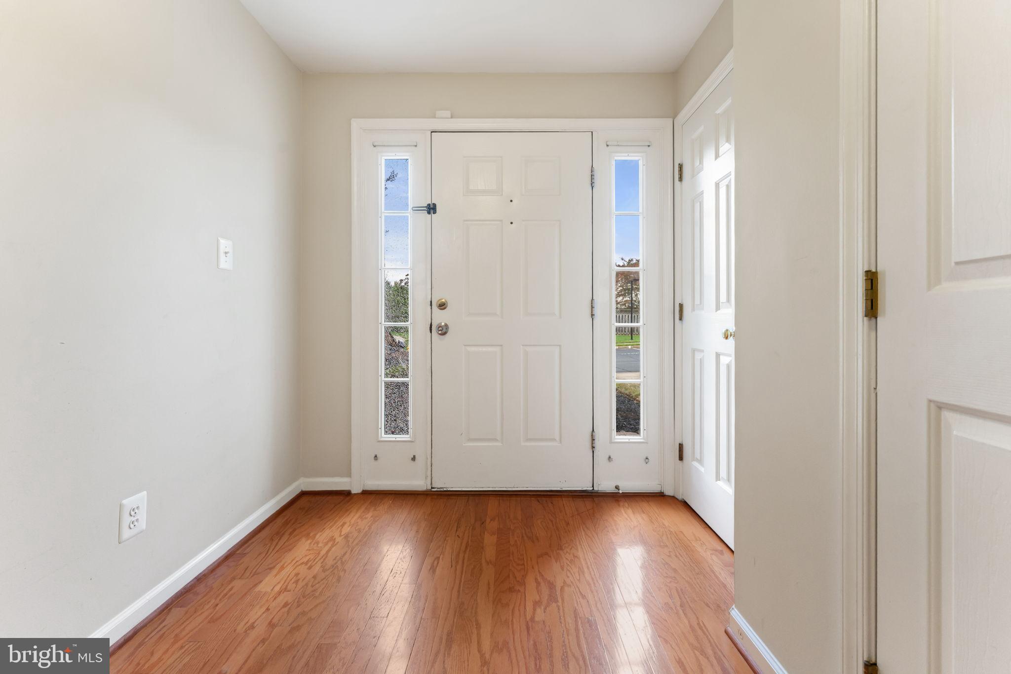 12734 Silvia Loop Woodbridge, VA 22192 - Photo 3 of 22 wooden floor in an empty room