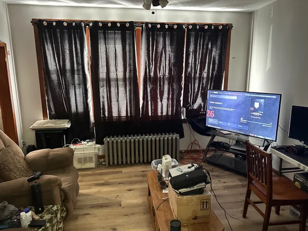 a bed sitting in a bedroom next to a window