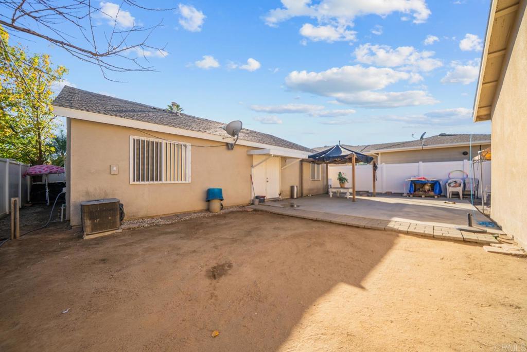 154 East 11th Street Perris, CA 92570 - Photo 23 of 37 a view of a house with a patio