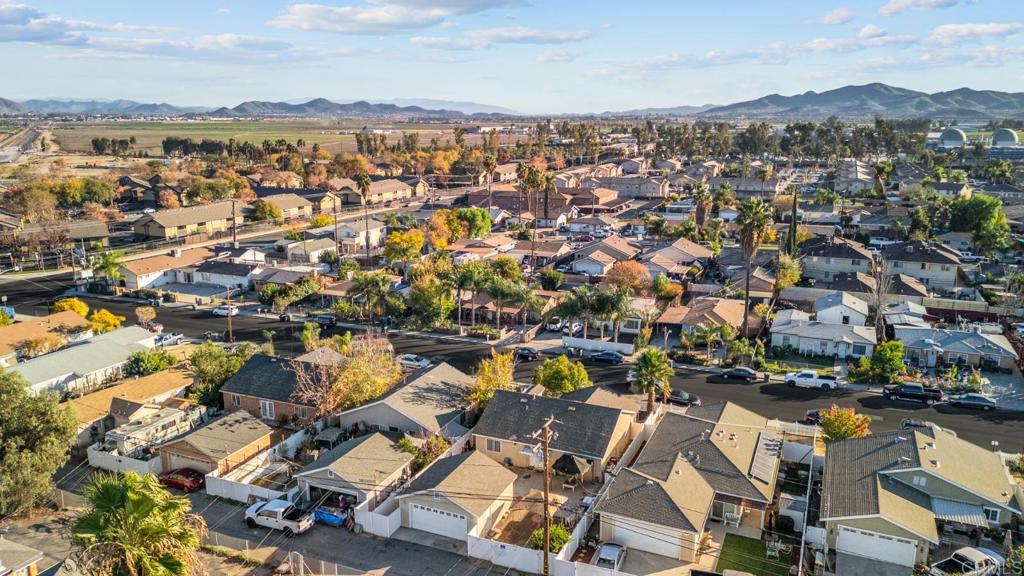154 East 11th Street Perris, CA 92570 - Photo 32 of 37 an aerial view of residential building with parking