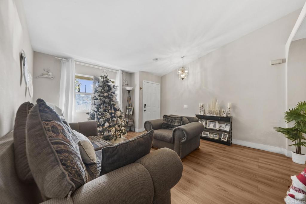 154 East 11th Street Perris, CA 92570 - Photo 4 of 37 a living room with furniture window and wooden floor