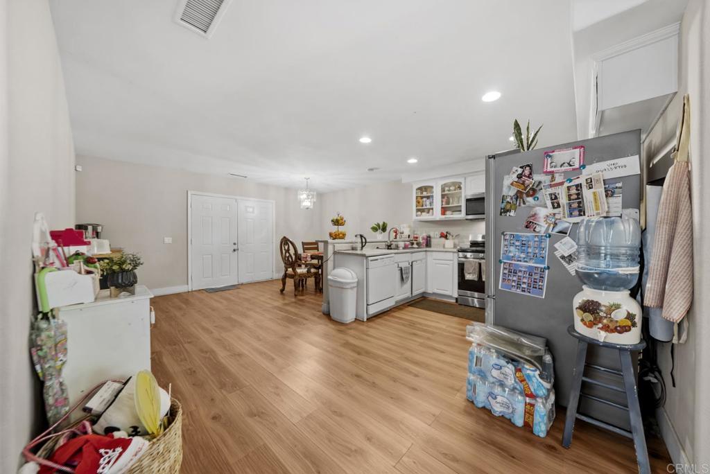 154 East 11th Street Perris, CA 92570 - Photo 6 of 37 a living room with furniture and a flat screen tv