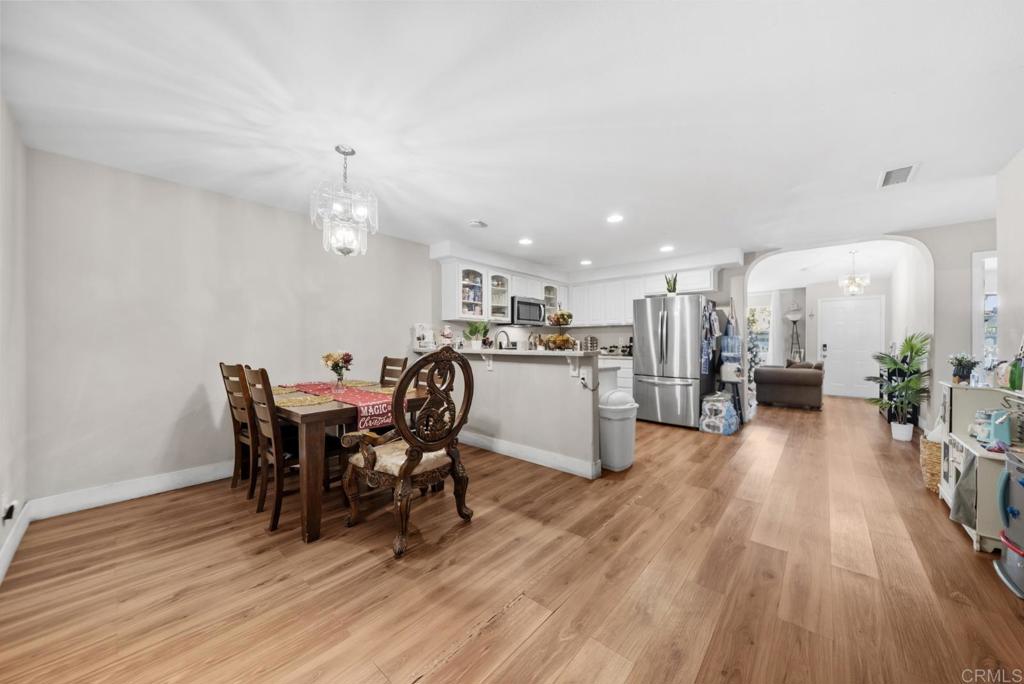 154 East 11th Street Perris, CA 92570 - Photo 7 of 37 a view of a dining room with furniture and wooden floor