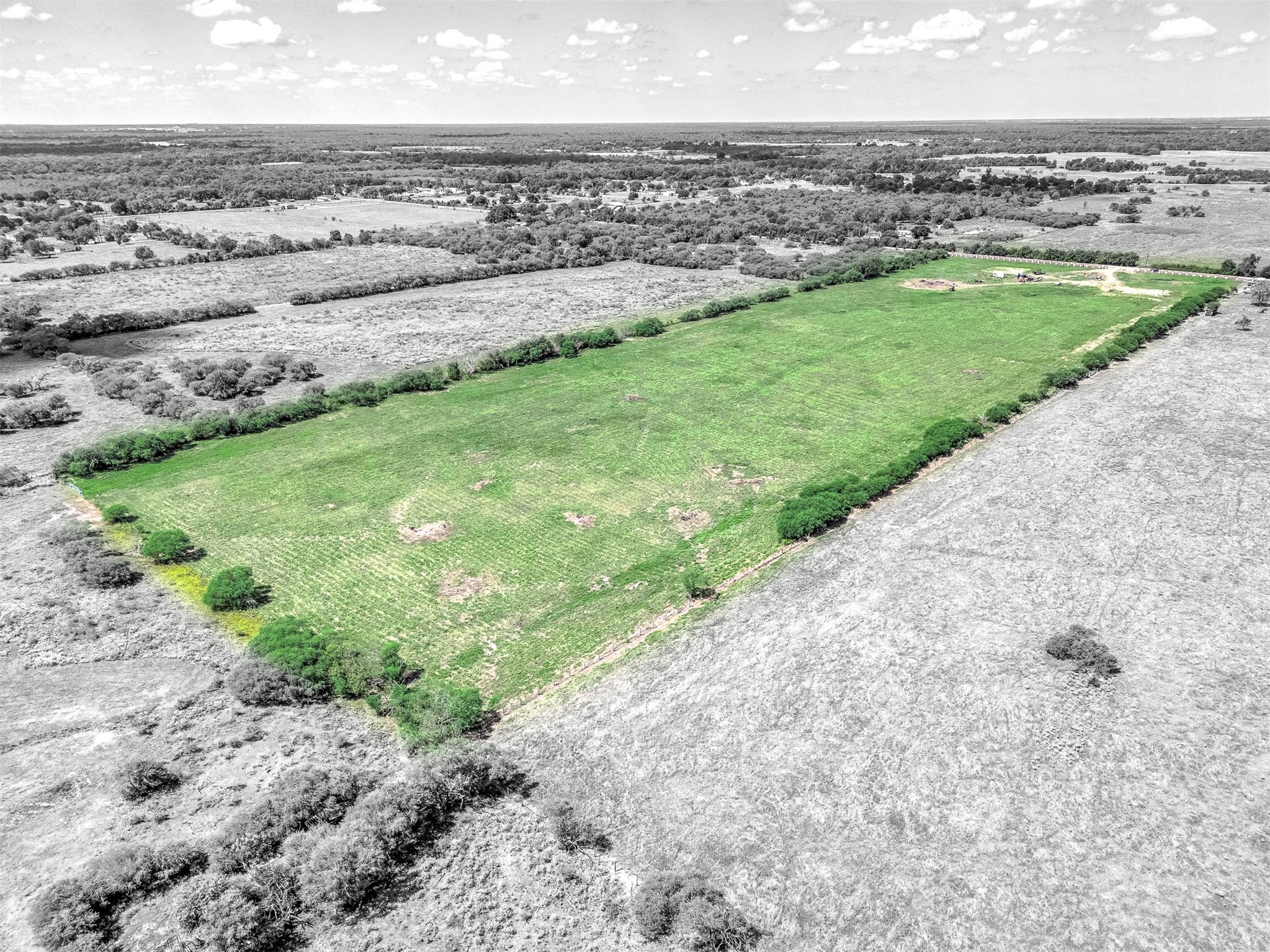 13911 Routt Point Road Needville, TX 77461 - Photo 5 of 6 a view of a field with a building in the background