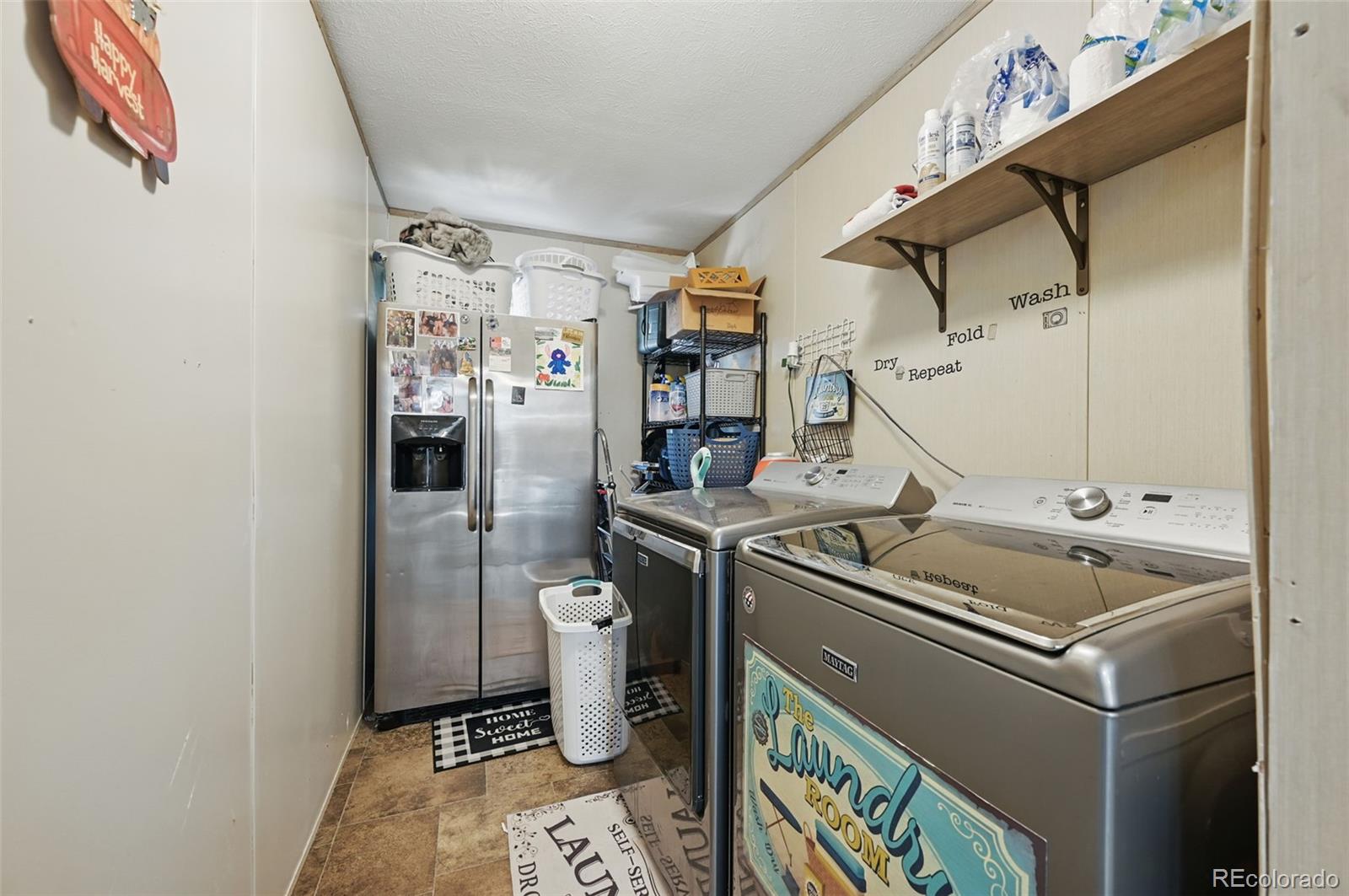 30890 Ken View Yoder, CO 80864 - Photo 12 of 36 a utility room with dryer and washer