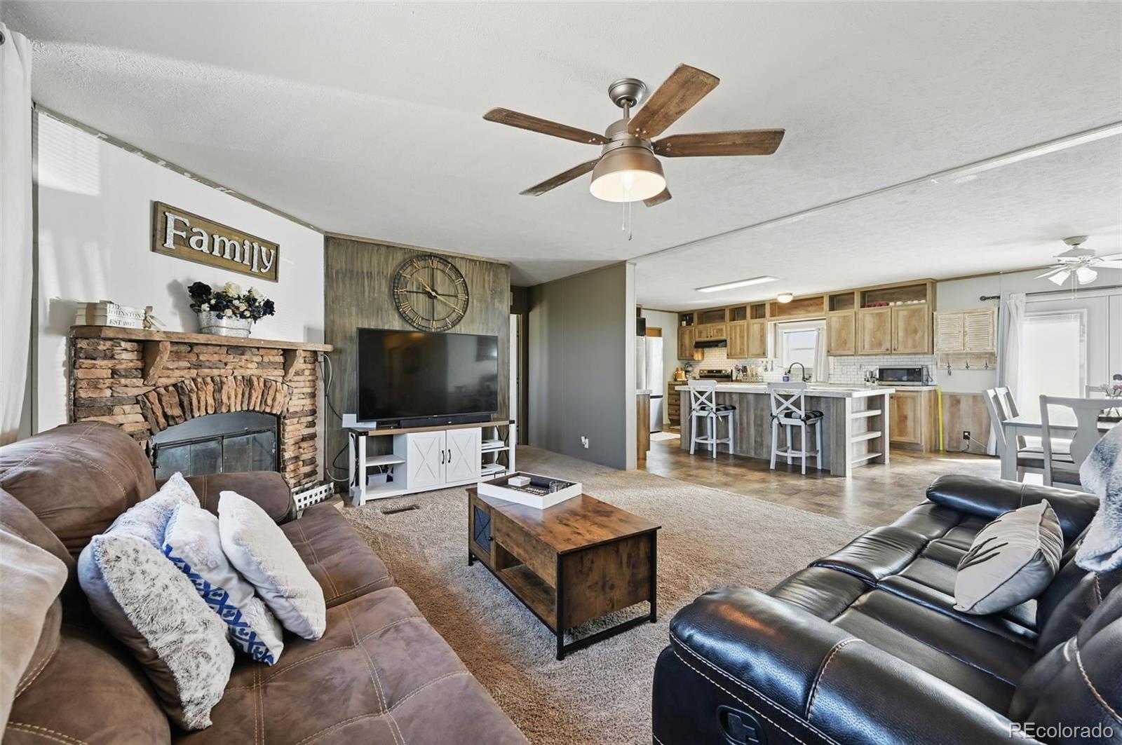 30890 Ken View Yoder, CO 80864 - Photo 16 of 36 a living room with furniture and a flat screen tv