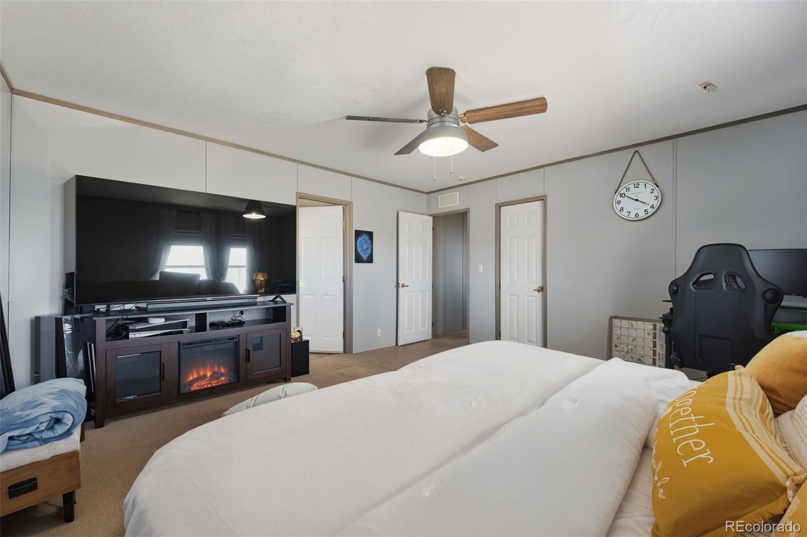 30890 Ken View Yoder, CO 80864 - Photo 18 of 36 a bedroom with a bed and a flat screen tv