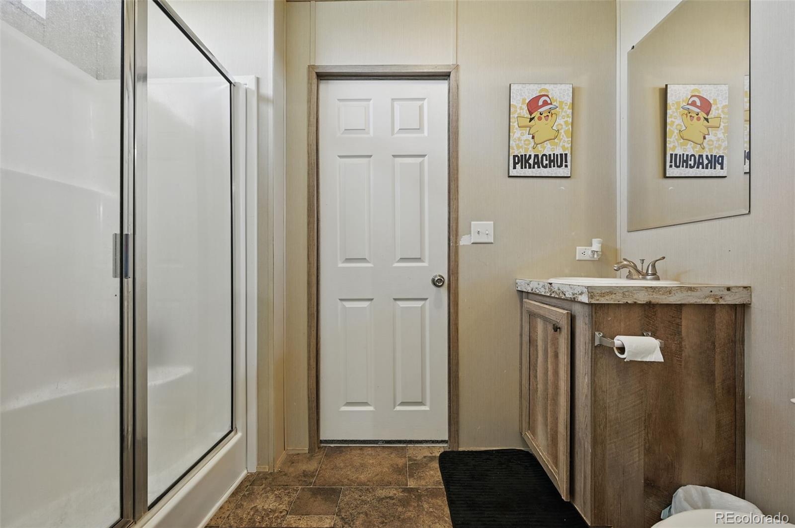 30890 Ken View Yoder, CO 80864 - Photo 24 of 36 a bathroom with a sink and a mirror
