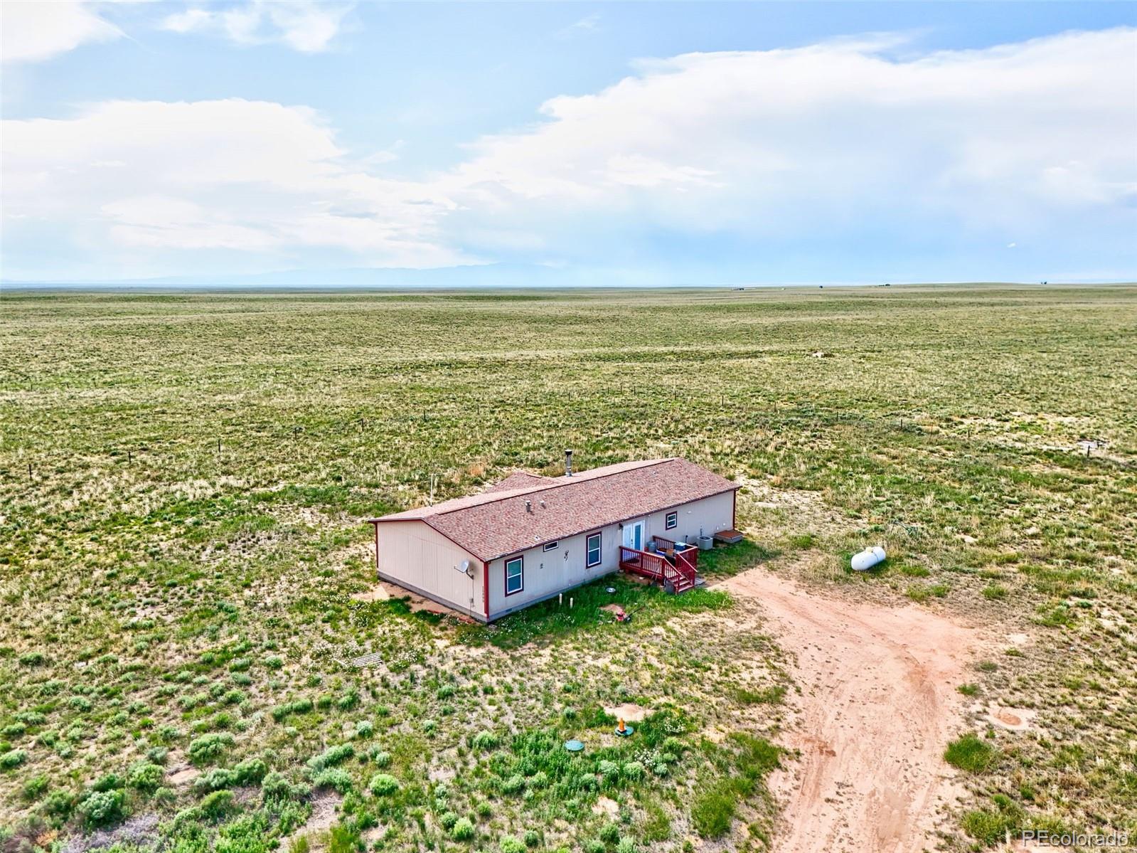 30890 Ken View Yoder, CO 80864 - Photo 27 of 36 a view of a lake with a big yard
