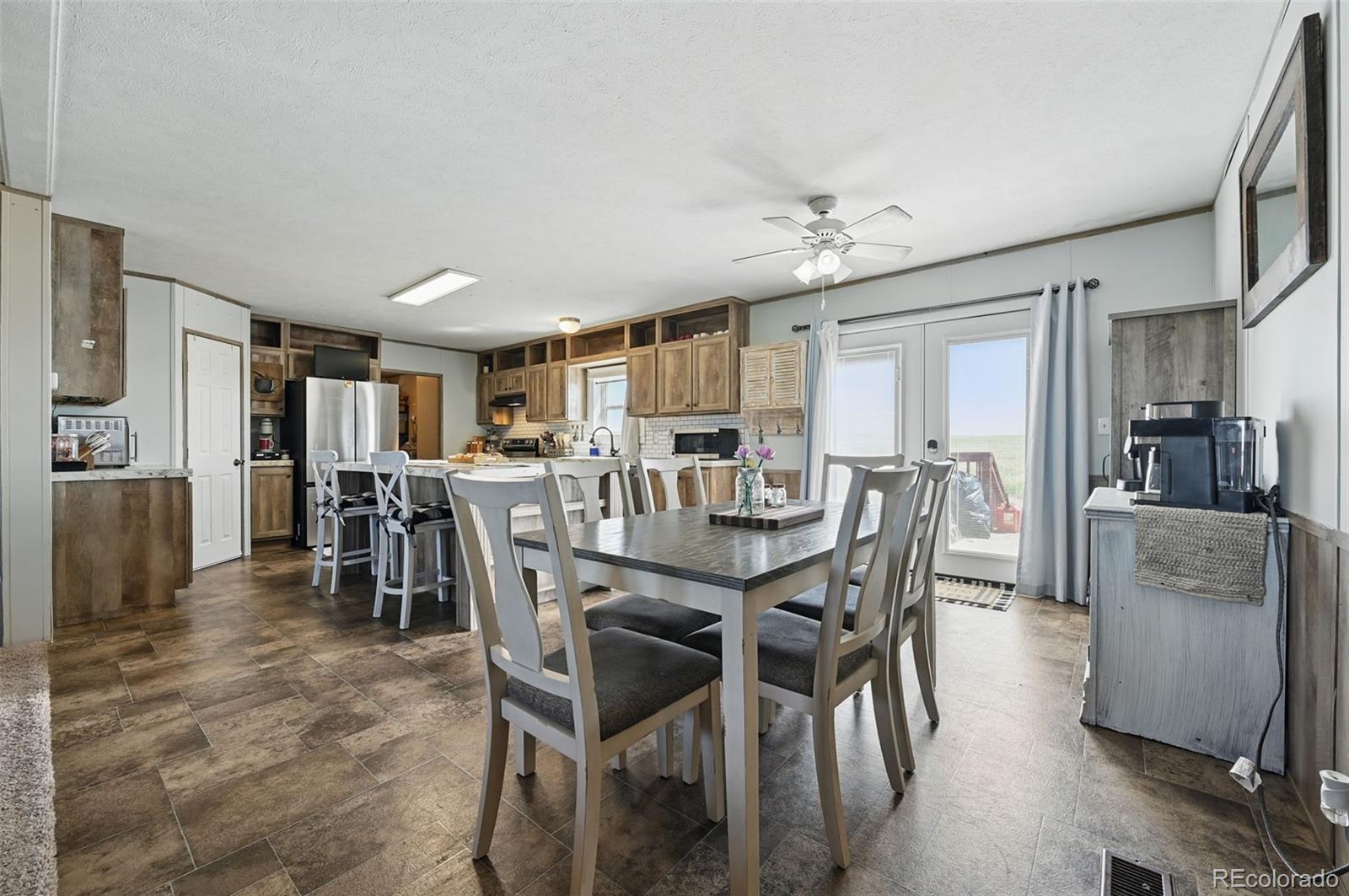 30890 Ken View Yoder, CO 80864 - Photo 6 of 36 a view of a dining room with furniture and a kitchen