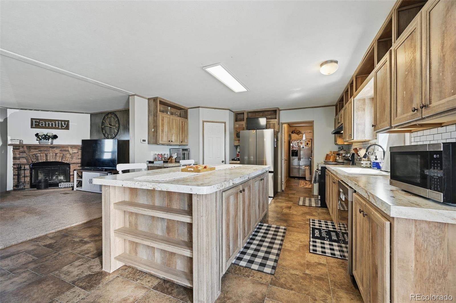 30890 Ken View Yoder, CO 80864 - Photo 8 of 36 a kitchen with a stove and a refrigerator