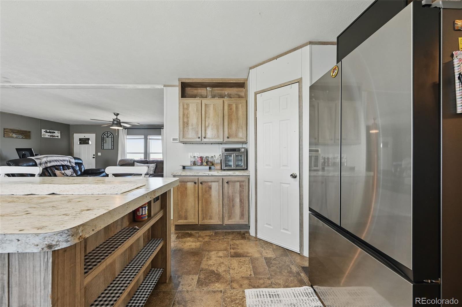 30890 Ken View Yoder, CO 80864 - Photo 9 of 36 a kitchen with a sink stove and refrigerator