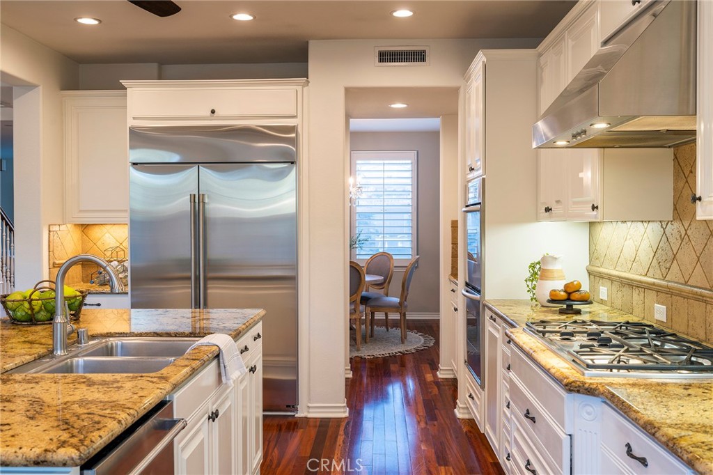 6 Shepherd Court Ladera Ranch, CA 92694 - Photo 17 of 68 a kitchen with stainless steel appliances granite countertop a sink stove and refrigerator