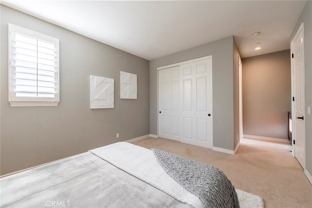 6 Shepherd Court Ladera Ranch, CA 92694 - Photo 21 of 68 a bedroom with a bed and a window