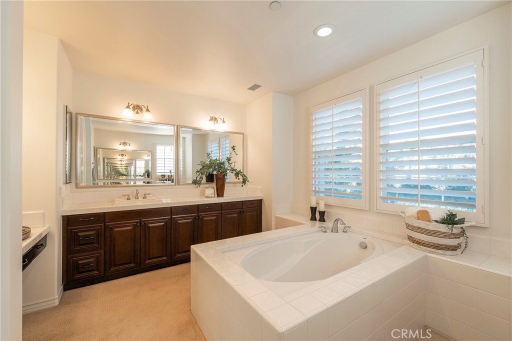 6 Shepherd Court Ladera Ranch, CA 92694 - Photo 26 of 68 a large white bathroom with a large tub and sink